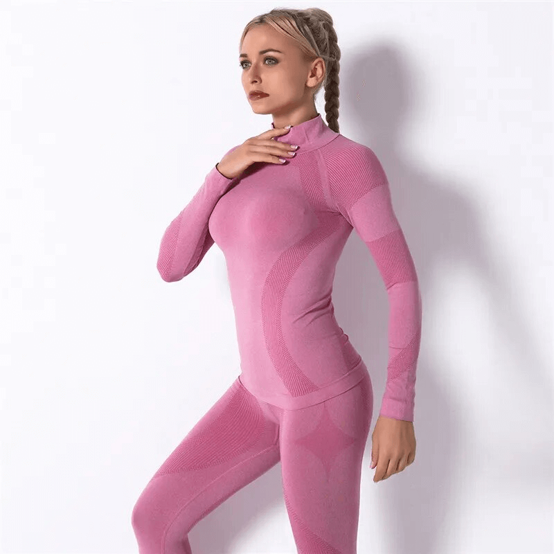 Woman in pink stretchy seamless long sleeves top for sport, demonstrating comfort and flexibility for female athletes, SKU: SF1652